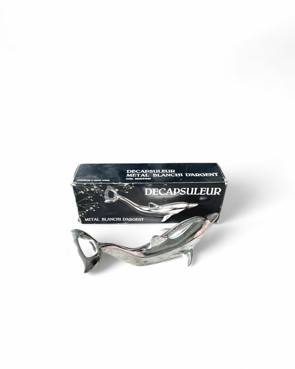 Silver-plated bottle opener in the shape of a dolphin