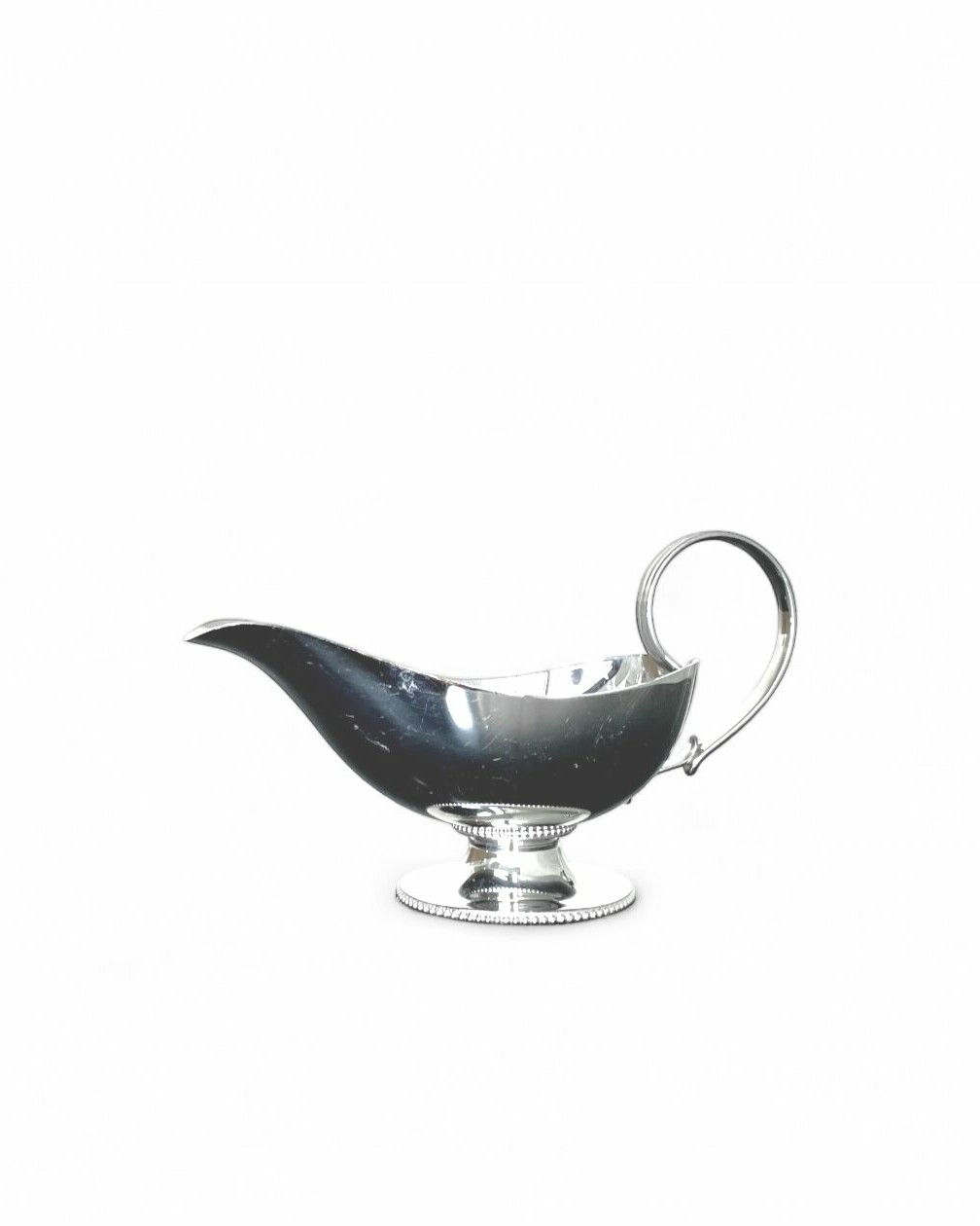 Sauce boat with silver-plated metal handle